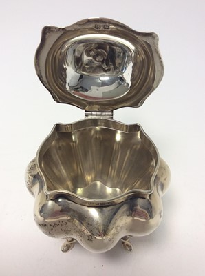 Lot 189 - Edwardian silver tea caddy of bombe form, domed hinged cover with ivory finial, raised on four hoof feet, approximately 8oz, 13cm in height