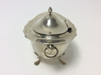 Lot 191 - Edwardian silver tea caddy of oval form with twin ring handles, and domed hinged cover, raised on four hoof feet, (Birmingham 1904), makers mark rubbed, at approximately 7oz, 11cm in width