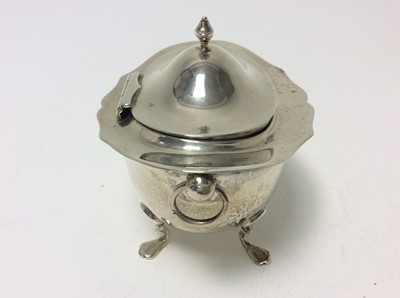Lot 191 - Edwardian silver tea caddy of oval form with twin ring handles, and domed hinged cover, raised on four hoof feet, (Birmingham 1904), makers mark rubbed, at approximately 7oz, 11cm in width