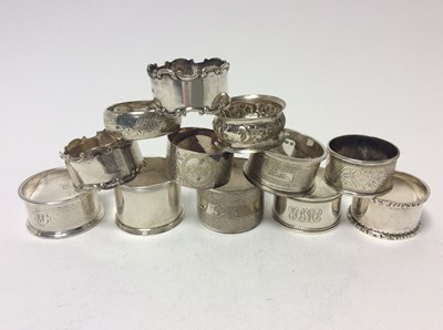 Lot 195 - Pair of George V silver napkin rings with scroll borders (Birmingham 1910), together with ten other silver napkin rings (various dates and makers) all at approximately 10oz (12 items)
