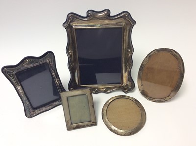 Lot 199 - Contemporary silver photograph frame with scroll borders, (Sheffield 1988), maker Carrs together with a group of four other silver photograph frames various dates and makers (9)