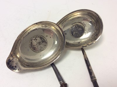 Lot 210 - Two Georgian silver toddy ladles set with coins, together with two silver handled Kings pattern pie servers and other various silver and white metal items (various dates and makers) (Qty)