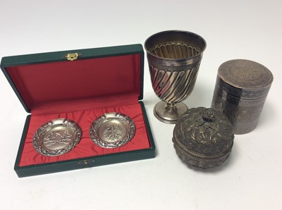 Lot 212 - Continental silver goblet with wrythern decoration and gilded interior, on circular foot (stamped 800), together with another Continental silver pot and cover with embossed decoration (stamped 800)...
