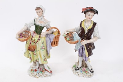 Lot 122 - Six pairs of Sitzendorf porcelain figures, mostly with floral encrusted scrollwork bases, printed marks, between 11cm and 19cm height