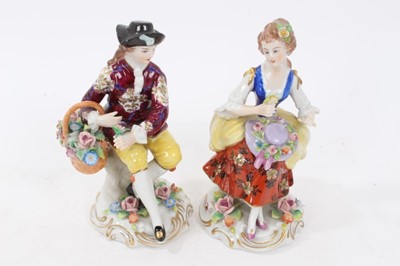 Lot 122 - Six pairs of Sitzendorf porcelain figures, mostly with floral encrusted scrollwork bases, printed marks, between 11cm and 19cm height