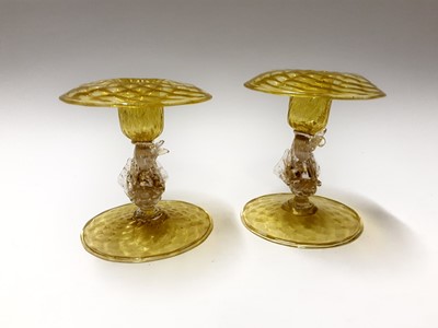 Lot 213 - Two good quality Murano Venitian yellow glass dolphin candlesticks