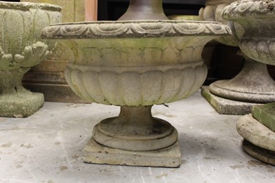 Lot 861 - Two concrete garden urns