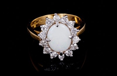 Lot 260 - Opal and diamond cluster ring with an oval cabochon opal measuring approximately 10mm x 8mm x 2.6mm, surrounded by a border of 14 brilliant cut diamonds in claw setting on 18ct yellow gold shank. E...