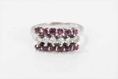 Lot 339 - Ruby and diamond three row ring with a row of six brilliant cut diamonds flanked by round mixed cut rubies in claw setting on 14ct white gold shank. Estimated total diamond weight approximately 0.3...