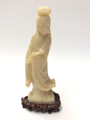 Lot 1094 - Chinese carved hardstone figure of a Goddess holding a sceptre, on hardwood base, 31cm in overall height (including stand)