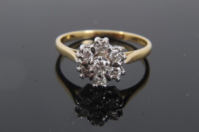 Lot 345 - Diamond cluster ring with a flower head cluster of seven brilliant cut diamonds in claw setting on 18ct yellow gold shank, estimated total diamond weight approximately 0.35cts. Ring size N½