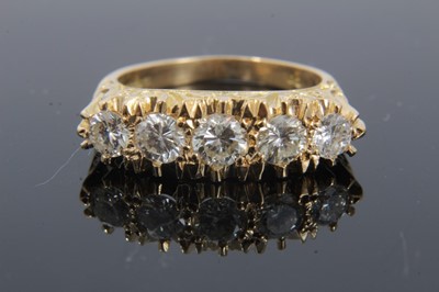 Lot 293 - Victorian style diamond five stone ring with five graduated brilliant cut diamonds in heavy gold carved scroll setting on 18ct yellow gold shank, estimated total diamond weight approximately 1.35ct...