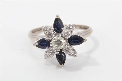 Lot 297 - Diamond and sapphire cluster ring with four marquise cut blue sapphires and 9 brilliant cut diamonds in tiered claw setting on white gold shank. Ring size O½.