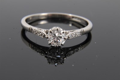 Lot 299 - Diamond single stone ring with a brilliant cut diamond estimated to weigh approximately 0.50cts in coronet claw setting with diamond set shoulders on platinum shank. Ring size T½