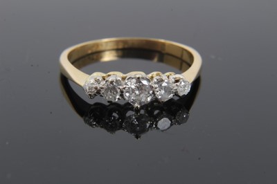 Lot 301 - Diamond five stone ring with five graduated old cut diamonds in platinum claw setting on 18ct yellow gold shank. Estimated total diamond weight approximately 0.35cts