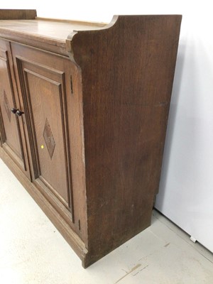 Lot 57 - Late Victorian oak cupboard with two panelled doors