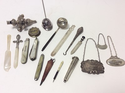 Lot 213 - Late Victorian silver babies rattle (Birmingham 1899), together with a George V silver Whiskey label (Birmingham 1925), maker Hukin & Heath, silver cheroot holder, silver book marks and other silve...
