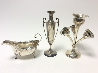 Lot 214 - George V silver epergne of conventional form on circular base, (Birmingham 1917), together with an Edwardian silver two handled spill vase (Birmingham 1908) and a silver sauce boat (marks rubbed) (...