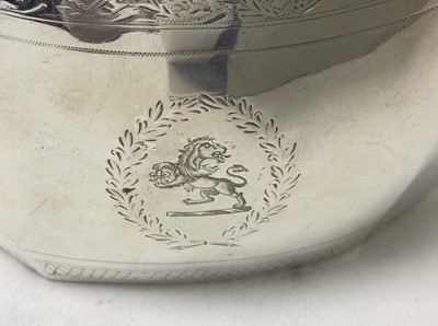 Lot 215 - Georgian Scottish Provincial silver twin handled sugar bowl of faceted octagonal form, with bands of bright cut decoration, reeded borders and an engraved armorial crest. Maker's mark only WS, poss...