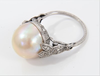 Lot 320 - Cultured pearl and diamond ring with a 13mm diameter pearl (not tested for natural origin) in platinum setting with rose cut diamonds and pierced back with diamond woven shoulders on engraved shank...