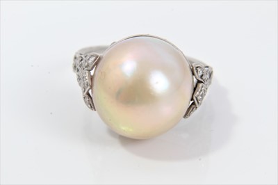 Lot 320 - Cultured pearl and diamond ring with a 13mm diameter pearl (not tested for natural origin) in platinum setting with rose cut diamonds and pierced back with diamond woven shoulders on engraved shank...