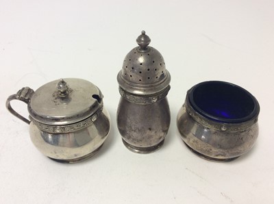 Lot 229 - Elizabeth II silver mustard pot of cauldron form with blue glass liner together and matching salt cellar and pepperette, (Sheffield 1955), maker Adie Brothers, together with a pair of George V silv...