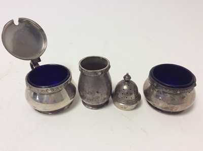 Lot 229 - Elizabeth II silver mustard pot of cauldron form with blue glass liner together and matching salt cellar and pepperette, (Sheffield 1955), maker Adie Brothers, together with a pair of George V silv...