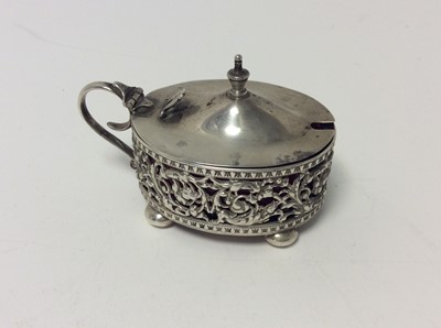 Lot 229 - Elizabeth II silver mustard pot of cauldron form with blue glass liner together and matching salt cellar and pepperette, (Sheffield 1955), maker Adie Brothers, together with a pair of George V silv...