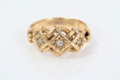 Lot 286 - Late Victorian 18ct gold and diamond three stone gypsy puzzle ring with three old cut diamonds in star-shape gypsy setting with puzzle style entwined gold bezel on plain 18ct gold shank. Ring size...