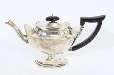 Lot 301 - Victorian silver teapot of navette form with oval ebony finial and angular handle, raised on oval pedestal foot, (London 1896), maker Isaac Millar Wilkinson, all at 16oz, 26cm from handle to spout