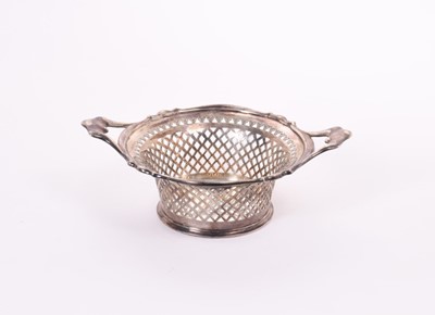 Lot 299 - Edwardian silver two handled bonbon dish of tapered circular form, with pierced decoration, (Sheffield 1905), maker Atkin Brothers, at approximately 8oz, 18.4cm across