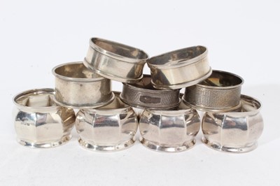 Lot 296 - Set of four George V silver napkin rings with faceted decoration (Birmingham 1918), together with five other silver napkin rings (various dates and makers), all at approximately 6oz (9)