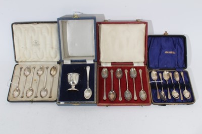 Lot 295 - Elizabeth II silver egg cup and spoon in fitted case, (Birmingham 1969) together with a set of six George V silver seal top tea spoons in a fitted case (Sheffield 1920) and two other cased sets of...