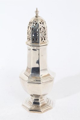 Lot 250 - George V silver sugar caster of faceted octagonal form with pieced slip in cover, on octagonal foot, (Sheffield 1916), maker Walker & Hall, at approximately 7oz, 19cm in overall height