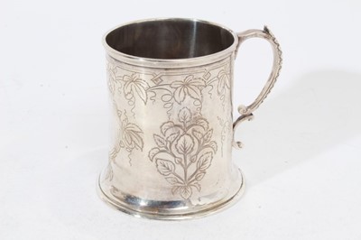 Lot 252 - Victorian silver Christening mug of cylindrical form with engraved foliate decoration, and scroll handle, (London 1868), maker S.S, at approximately 8oz, 8.5cm in overall height