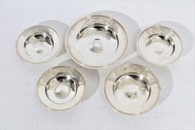 Lot 288 - Set of three Elizabeth II silver Armada dishes (London 1961), undersides marked Harrods, each 8.5cm in diameter together with two other silver Armada dishes (London 1964 & 1969), all at approximate...
