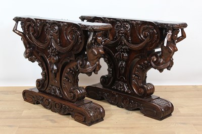 Lot 989 - Impressive pair of heavily carved hardwood table pedestals