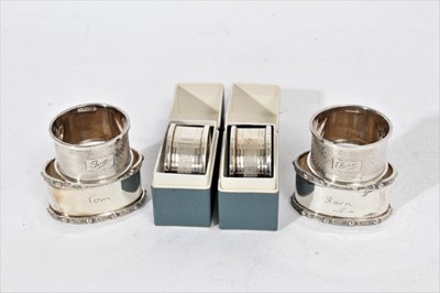 Lot 281 - Pair of Elizabeth II silver napkin rings of oval form, engraved Tom & Sara (Birmingham 1965), maker Garrard & Co Ltd, together with another pair of silver napkin rings similarly engraved (Birmingha...