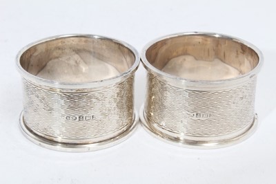Lot 281 - Pair of Elizabeth II silver napkin rings of oval form, engraved Tom & Sara (Birmingham 1965), maker Garrard & Co Ltd, together with another pair of silver napkin rings similarly engraved (Birmingha...