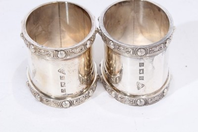 Lot 281 - Pair of Elizabeth II silver napkin rings of oval form, engraved Tom & Sara (Birmingham 1965), maker Garrard & Co Ltd, together with another pair of silver napkin rings similarly engraved (Birmingha...
