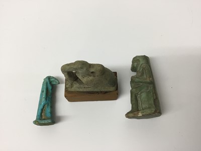 Lot 509 - Ancient Egyptian faience amulets of Isis and Horus, and a blue faience amulet of Anubis, the largest 3.25cm height