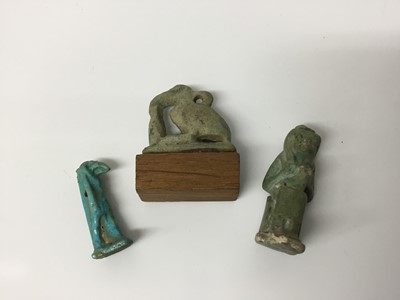 Lot 509 - Ancient Egyptian faience amulets of Isis and Horus, and a blue faience amulet of Anubis, the largest 3.25cm height