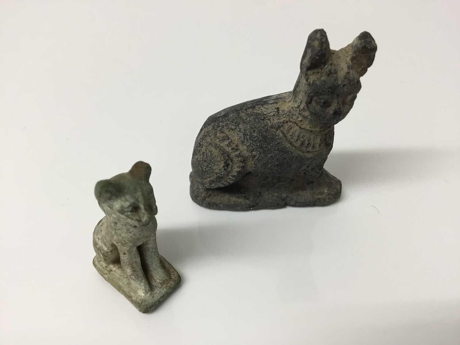 Lot 511 - Ancient Egyptian amulet of Bastet in cat form, c.1000-332 BC, and a 19th/20th century Egyptian Grand Tour cat amulet, the largest measuring 4.25cm height