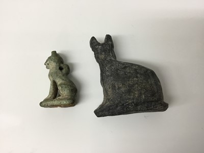 Lot 511 - Ancient Egyptian amulet of Bastet in cat form, c.1000-332 BC, and a 19th/20th century Egyptian Grand Tour cat amulet, the largest measuring 4.25cm height