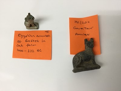 Lot 511 - Ancient Egyptian amulet of Bastet in cat form, c.1000-332 BC, and a 19th/20th century Egyptian Grand Tour cat amulet, the largest measuring 4.25cm height