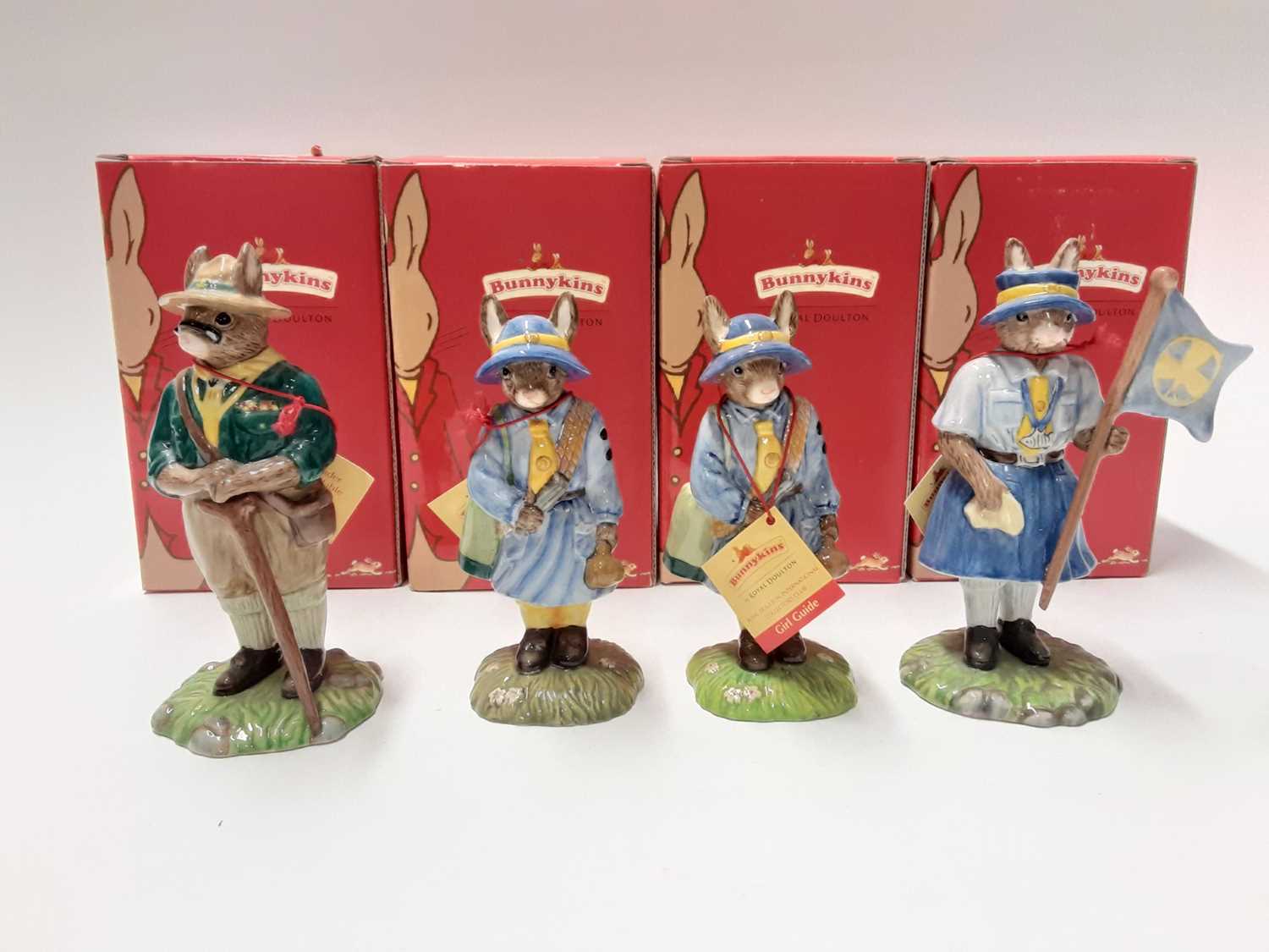 Lot 120 - Royal Doulton Bunnykins Scout Leader DB432, 2x Girl Guide DB431 & Guide Leader DB433, boxed