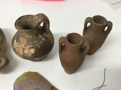 Lot 516 - Roman items, including an oil lamp and flagon, a tiny amulet of Jasper, and some items possibly later, including two amphora and three iridescent glass shards