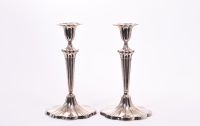 Lot 261 - Pair of Edwardian silver candlesticks, with shaped tapering stems and inverted bell shaped candle holders, separate sconces, on shaped oval bases, engraved with an Earl's Crown 'from H to F. R. Apr...