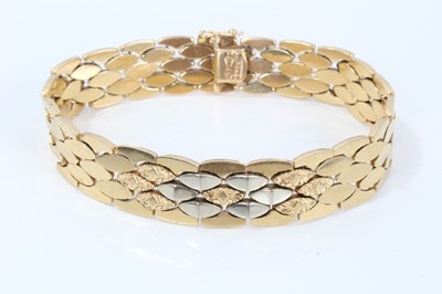 Lot 315 - 18ct two-colour gold bracelet with articulated links, 19cm