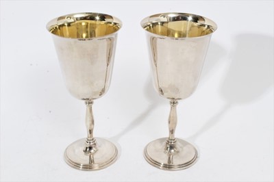 Lot 263 - Pair of Elizabeth II silver goblets of inverted bell form, with gilded interiors and bulbous stems, on circular feet, (Birmingham 1973), maker Frank Hawker Ltd, all at 13oz, 17.6cm in overall heigh...